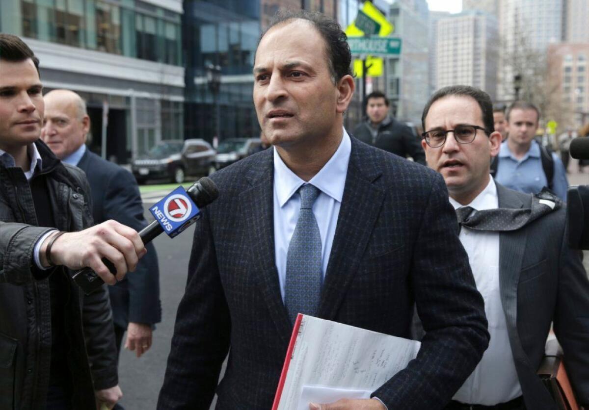 David Sidoo leaves federal court in Boston after a March 2019 hearing.