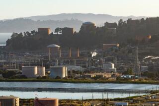 RICHMOND, CALIFORNIA - JUNE 18: In this aerial view, part of the Chevron refinery is seen in Richmond, California on June 18, 2024. The city of Richmond, California is considering a tax that will cost Chevron $1 per barrel and will raise approximately $30-$50 million. Supporters of the tax say Chevron is poisoning their air and causing local residents to get sick. Chevron says the city is trying to make up for budget shortfalls and will cost everyone more at the pumps. (Josh Edelson / For the Times)