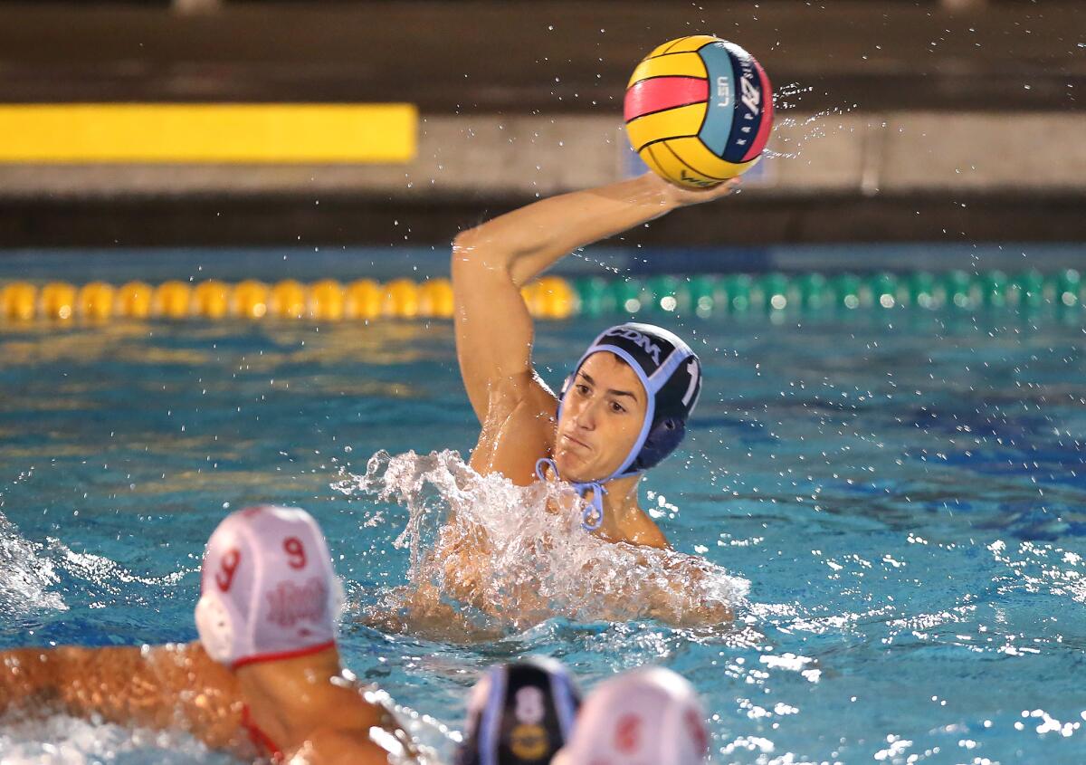 Corona del Mar's Aden Mina takes a shot and scores in a nonleague match against Mater Dei on Saturday.