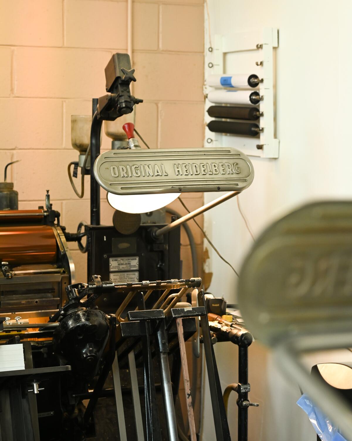 One of Aardvark's six Heidelberg presses, vintage printing machines that apply designs directly to paper.