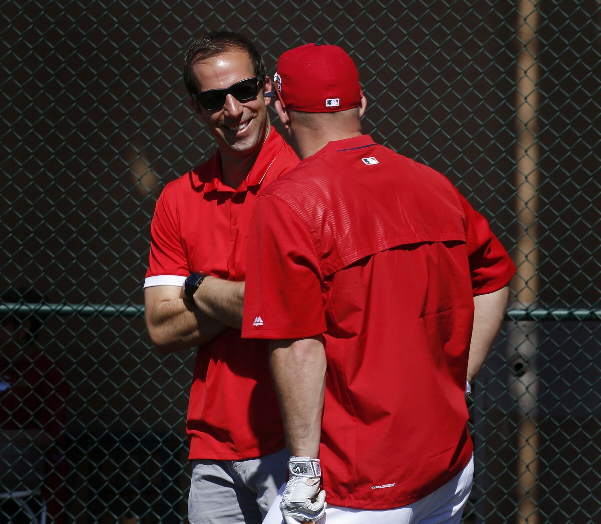 Angels General Manager Billy Eppler, left, chats with outfielder Mike Trout during spring training.