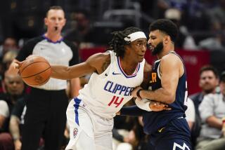 Los Angeles Clippers guard Terance Mann, front left, drives against Denver Nuggets guard Jamal Murray, right, during the first half of an NBA basketball game, Thursday, Oct. 19, 2023, in Los Angeles. (AP Photo/Ryan Sun)