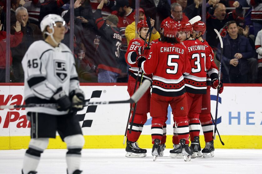 The Carolina Hurricanes celebrate a goal by Brent Burns during the first period of an NHL hockey game against the Los Angeles Kings in Raleigh, N.C., Tuesday, Jan. 31, 2023. (AP Photo/Karl B DeBlaker)