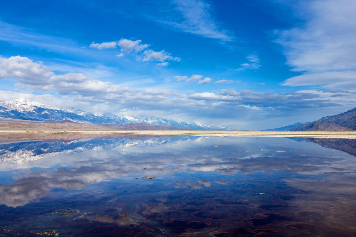High clouds and the Sierra Nevada are reflected in a resurgent Owens Lake on Feb. 14.