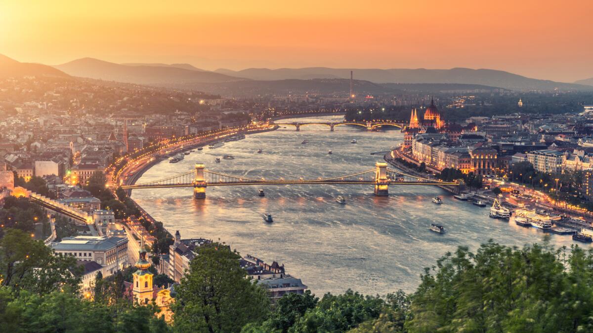 The Danube River flows past the Parliament building and Chain Bridge in Budapest, Hungary, one of 10 countries the river snakes through on its 1,770-mile journey.