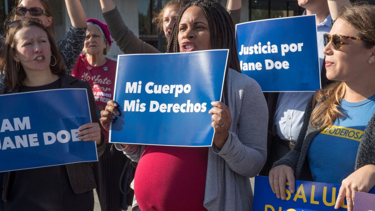In Washington on Friday, activists with Planned Parenthood demonstrate in support of a pregnant 17-year-old in a Texas immigration detention facility who is asking to be allowed to obtain an abortion.