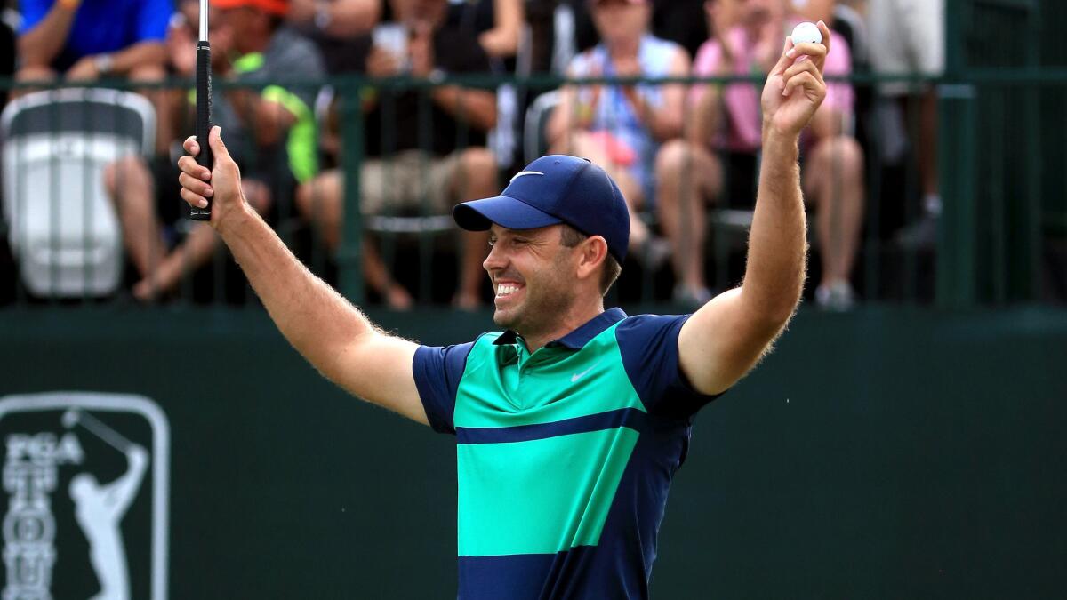 Charl Schwartzel reacts after making a putt on the first playoff hole to win the Valspar Championship on Sunday.