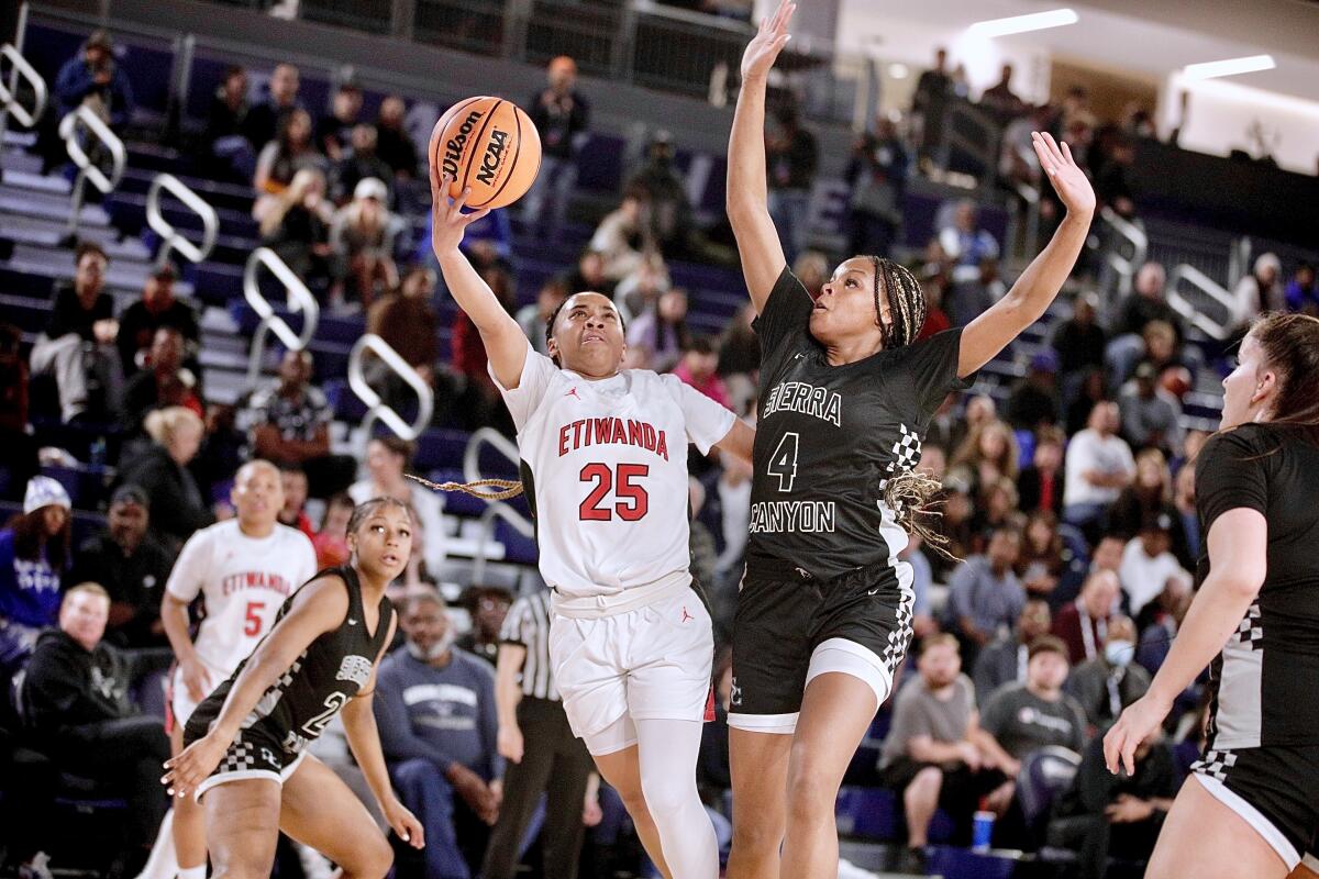 Eitwanda’s Aliyahna Morris make a layup over Sierra Canyon's Mackenly Randolph.