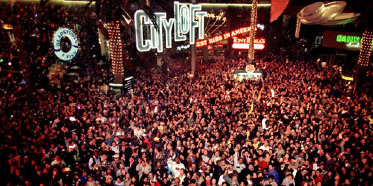 Revelers count down to the New Year at Universal CityWalk.