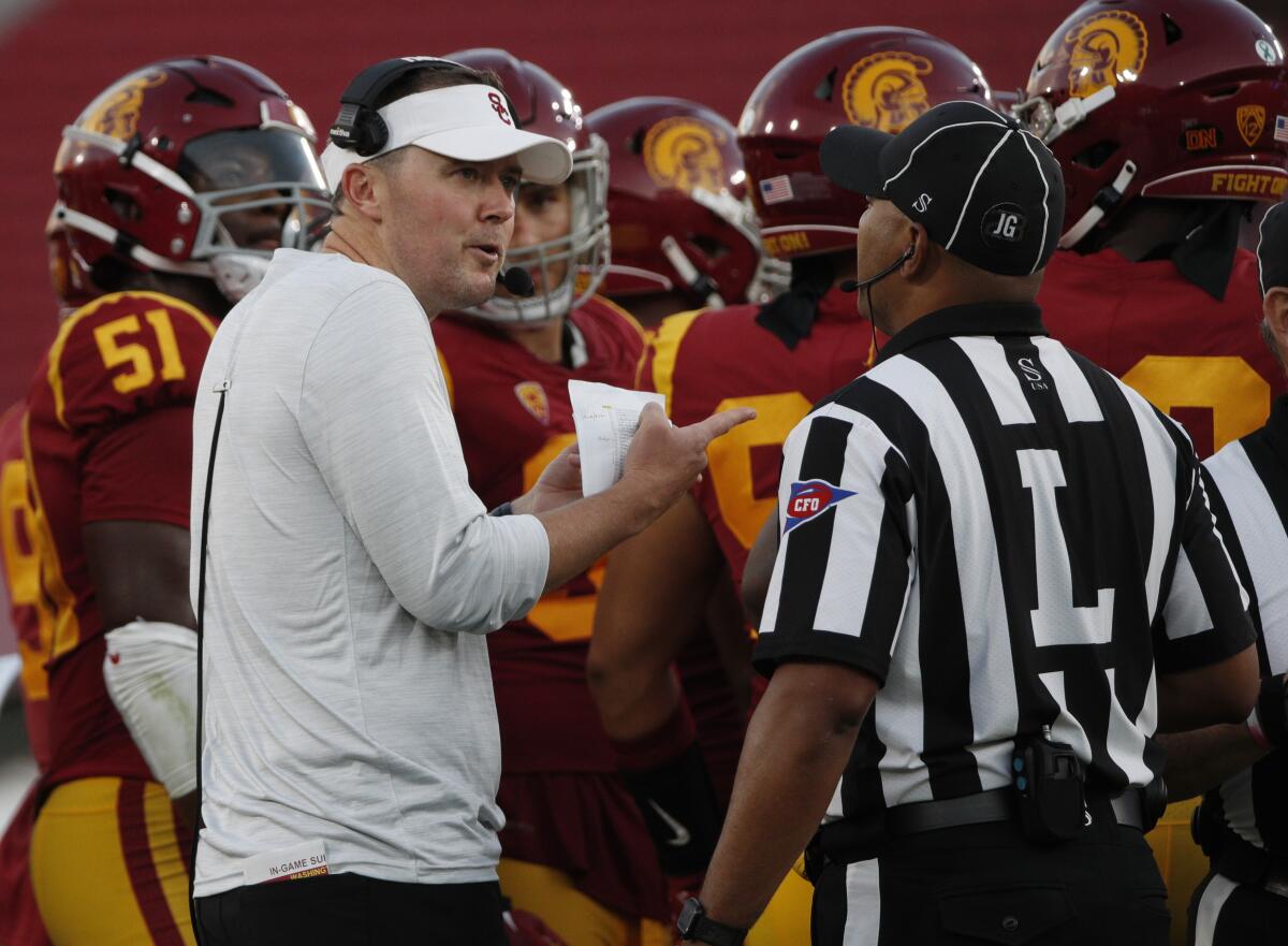 USC coach Lincoln Riley questions a call to the official against Washington State.