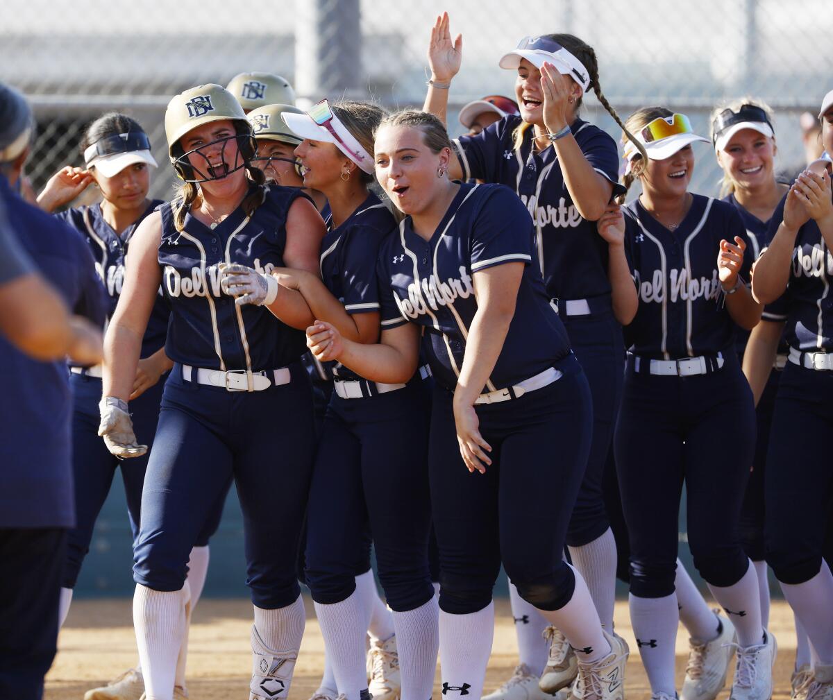Del Norte's Alexa Brunetti, left, celebrates a home run against Valley View.