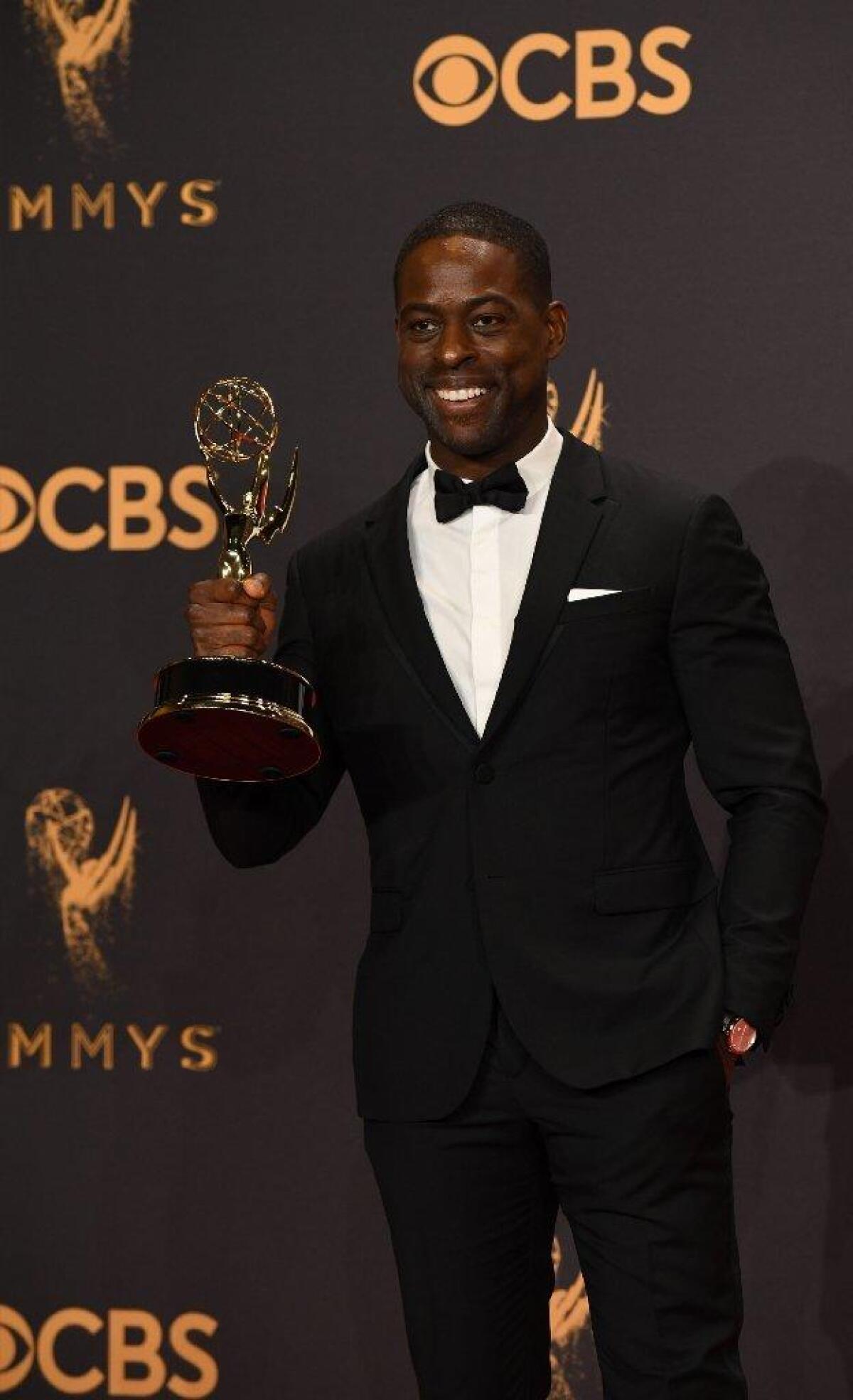 Sterling K. Brown backstage with his Emmy for lead actor in a drama series.