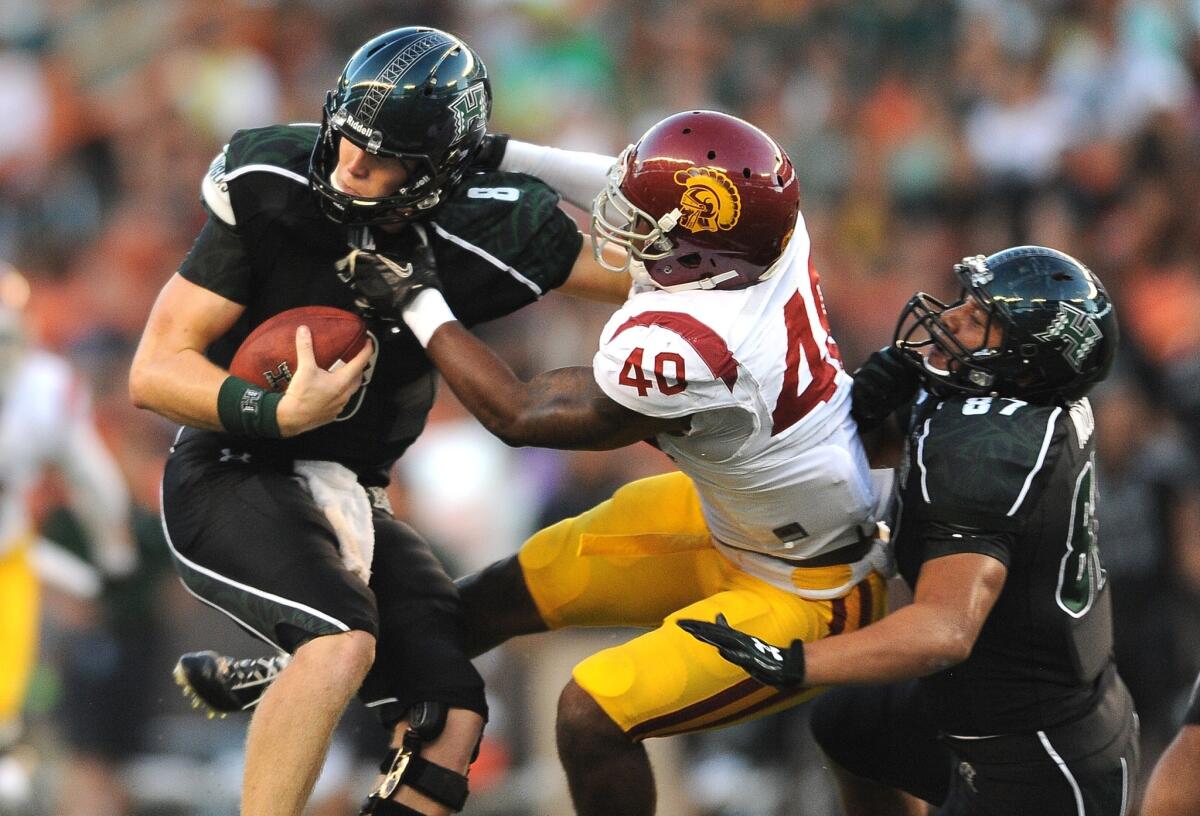 USC linebacker Jabari Ruffin tries to sack Hawaii quarterback Taylor Graham at Aloha Stadium.