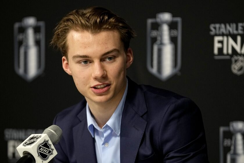 FILE - NHL draft prospect Connor Bedard speaks to the media prior to Game 2 of the NHL hockey Stanley Cup Finals between the Florida Panthers and the Vegas Golden Knights, Monday, June 5, 2023, in Las Vegas. Bedard, 17, who is highly anticipated to be selected first in the NHL draft by the Chicago Blackhawks, joins his fellow draft-eligible prospects in participating at the NHL combine. (AP Photo/Abbie Parr, File)