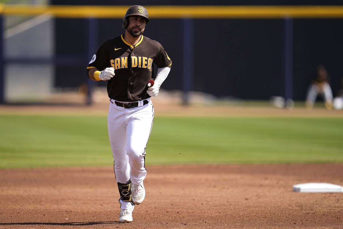The Padres' Alfonso Rivas runs the bases after hitting a two-run homer in a spring training game