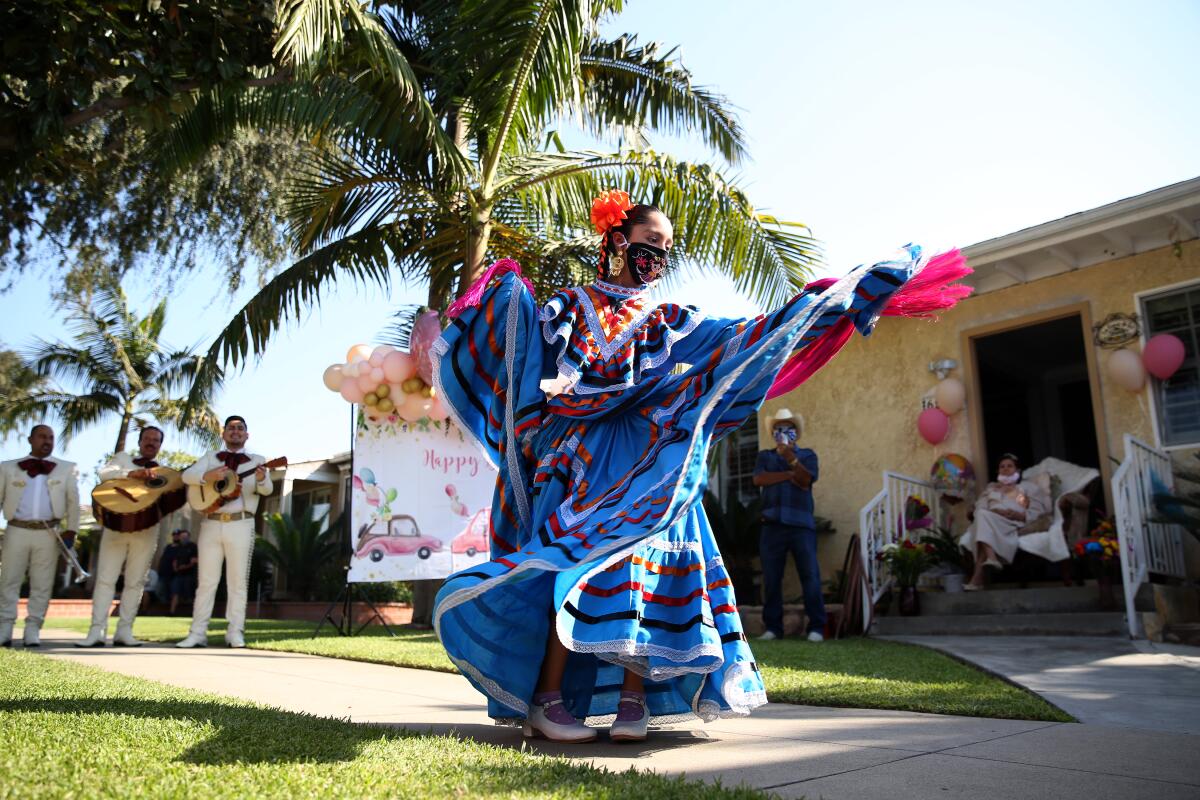 Isabella Navarro, 10, performs a Mexican dance to celebrate her great-grandmother Angelita Arellano's 98th birthday.