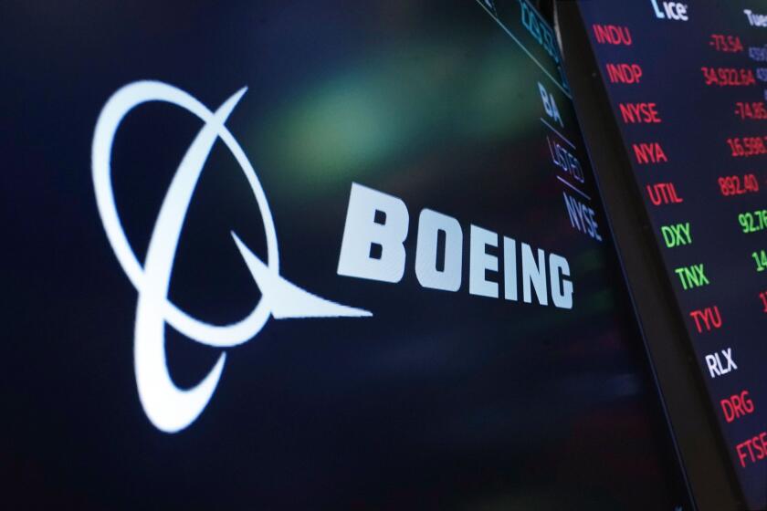 FILE - The logo for Boeing appears on a screen above a trading post on the floor of the New York Stock Exchange, July 13, 2021. Boeing is due to tell federal regulators Thursday, May 30, 2024, how it plans to fix the safety and quality problems that have plagued its aircraft-manufacturing work in recent years. (AP Photo/Richard Drew, File)