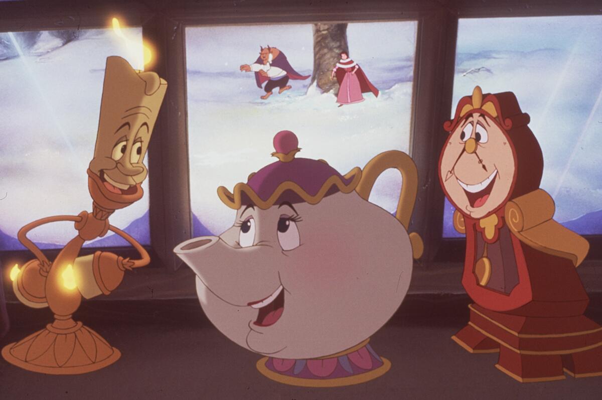 A candlestick, a teapot and a clock in a scene from the animated film "Beauty and the Beast" (1991)