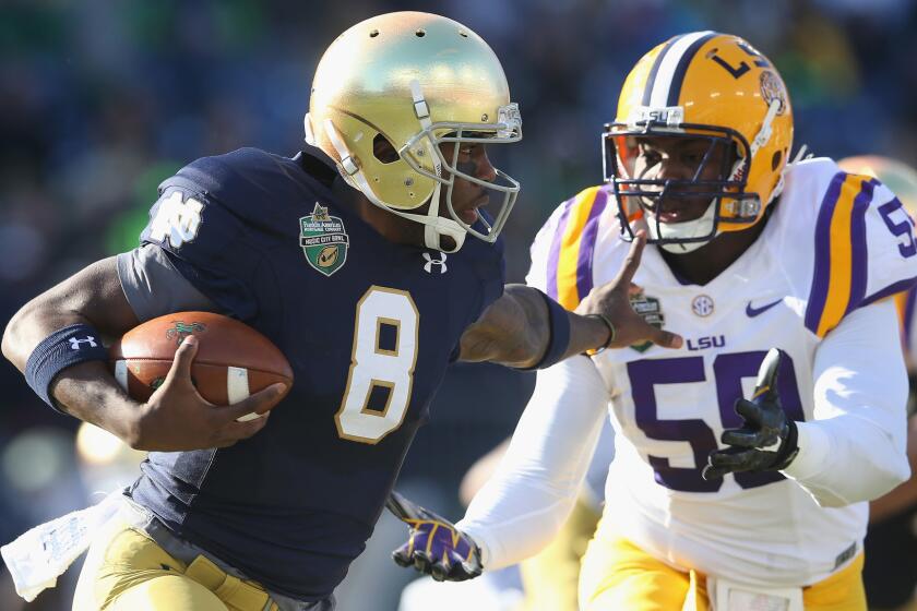 Notre Dame quarterback Malik Zaire carries the ball during the Fighting Irish's 31-28 victory over LSU in the Music City Bowl on Tuesday.
