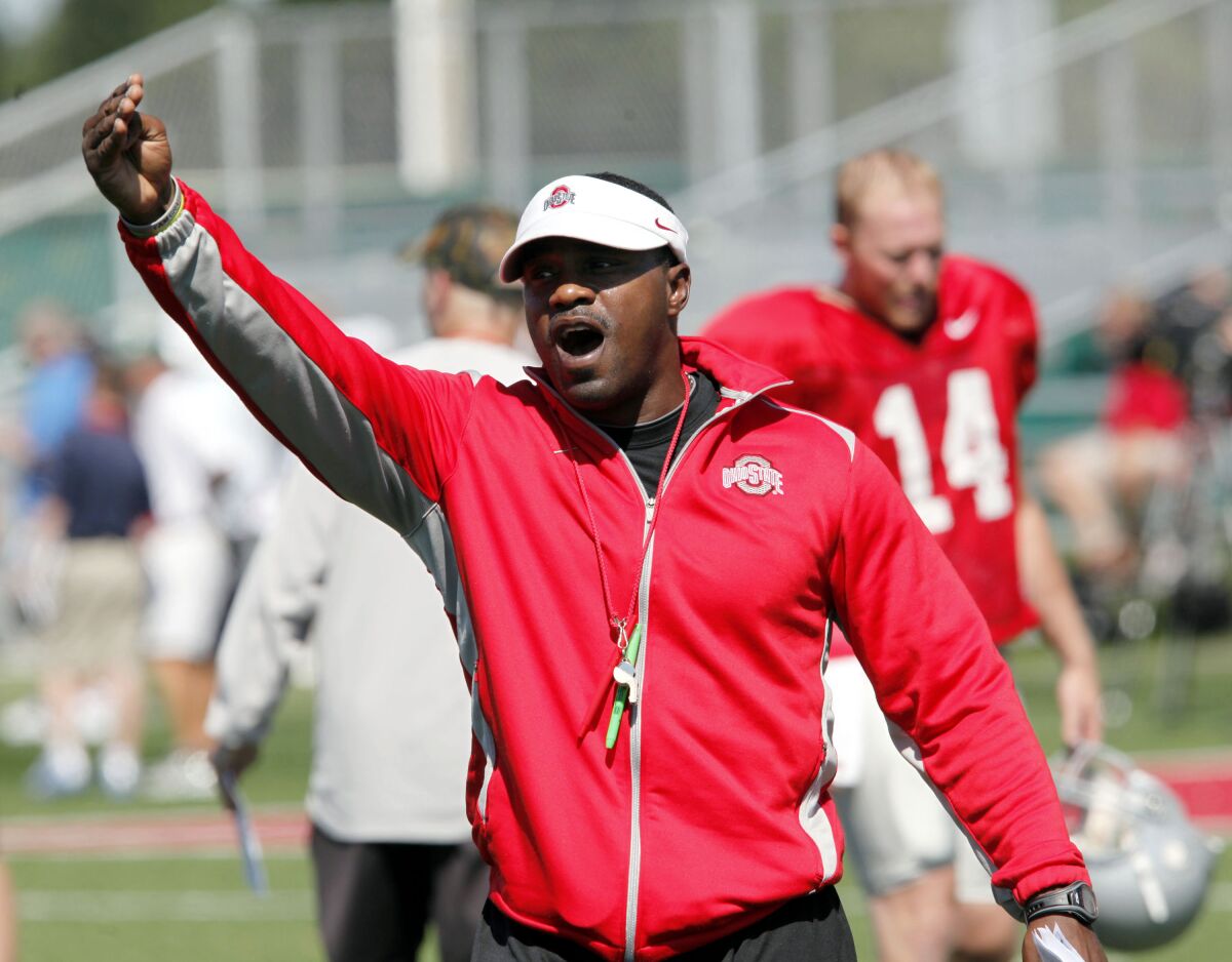 FILE - Then-Ohio State receivers coach Stan Drayton calls out to players during NCAA college football practice in Columbus, Ohio, Aug. 16, 2011. New Temple coach Stan Drayton is one of 15 Black head coaches currently set to start next season at 131 FBS schools. (AP Photo/Terry Gilliam, File)