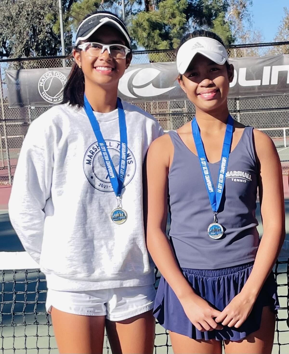 Marshall sisters Johanna (left) and Julianna Galindo after the LA City Section girls' tennis finals last Wednesday.