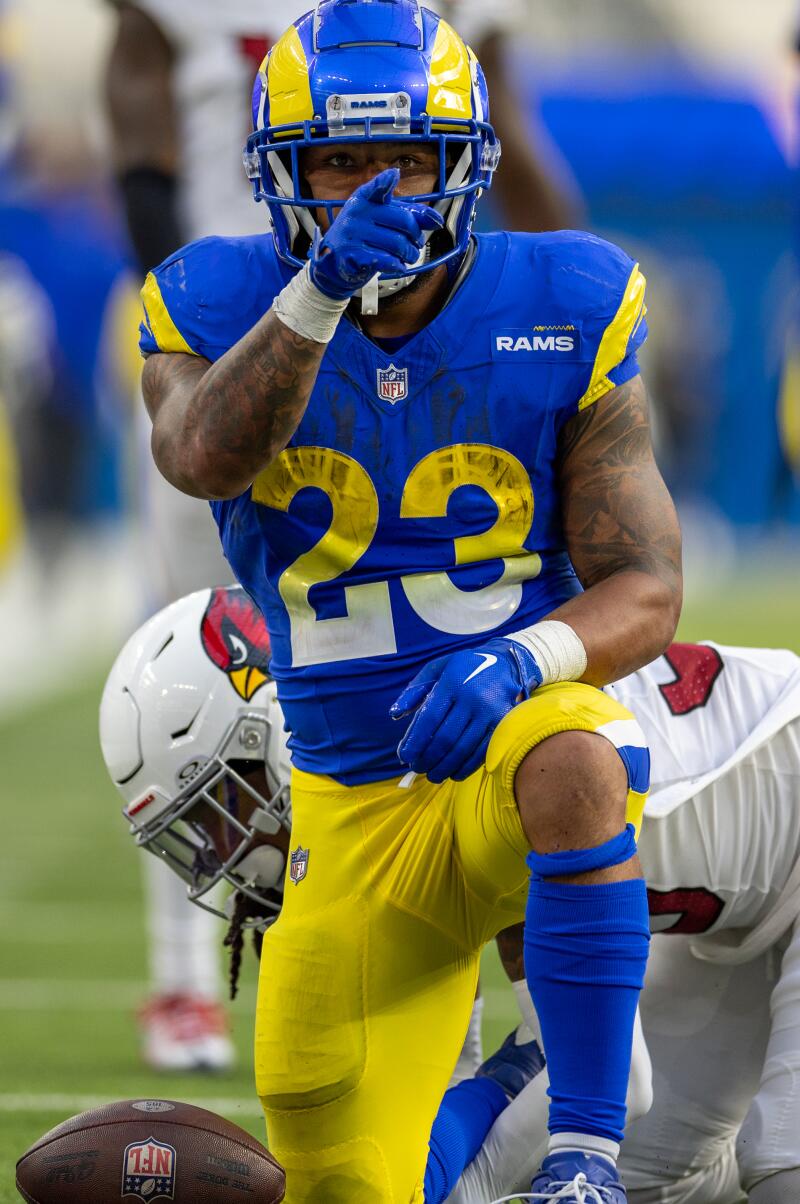 Rams running back Kyren Williams makes a first-down gesture after a carry in the second half against the Cardinals.