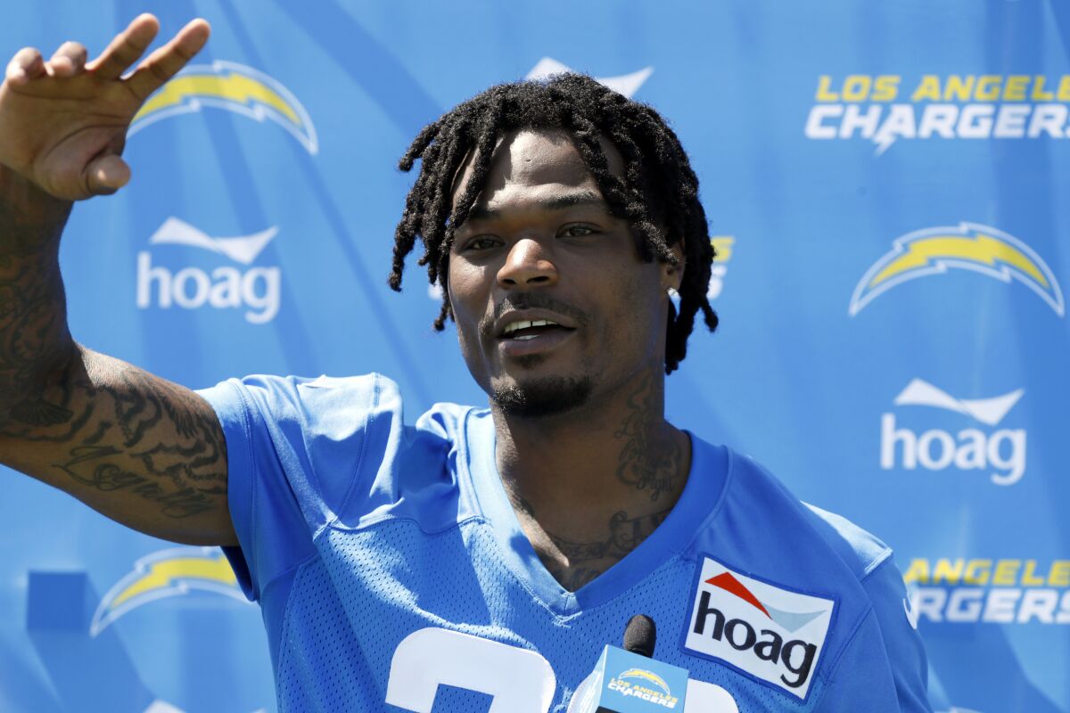 Safety Derwin James gestures during a news conference after practice Chargers' first day in training camp.