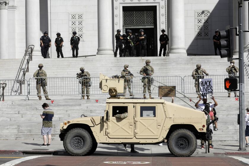 LOS ANGELES, CA - MAY 31: The California National Guard is deployed at City Hall in downtown Los Angeles on Sunday, May 31, 2020 in Los Angeles, CA. (Myung J. Chun / Los Angeles Times)