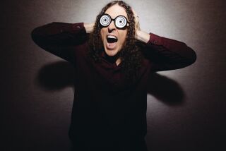 In this July 17, 2014 photo, “Weird Al” Yankovic poses for a portrait in Los Angeles. Billboard reported that Yankovic's “Mandatory Fun” debuted at No. 1 this week with more than 80,000 units sold. That’s almost double the amount his last album, "Alpocalypse," sold in its debut week in 2011. (Photo by Casey Curry/Invision/AP)
