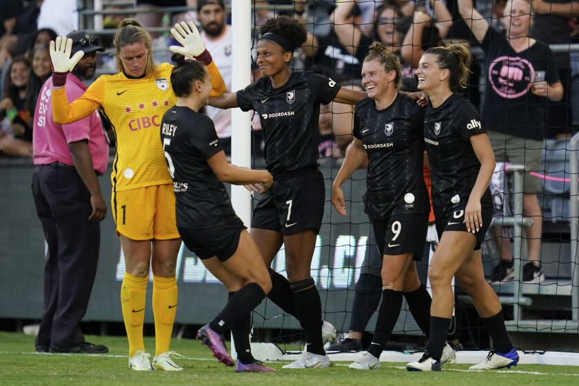 Angel City FC midfielder Savannah McCaskill (9) celebrates with teammates after scoring during the second half of an NWSL soccer match against the Chicago Red Stars in Los Angeles, Sunday, Aug. 14, 2022. (AP Photo/Ashley Landis)