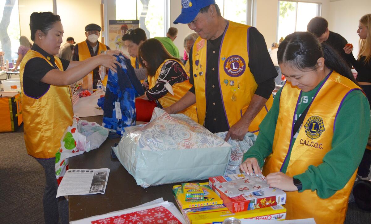Chinese American Lions Club of O.C. volunteers at the Miracle for Kids holiday gift event.
