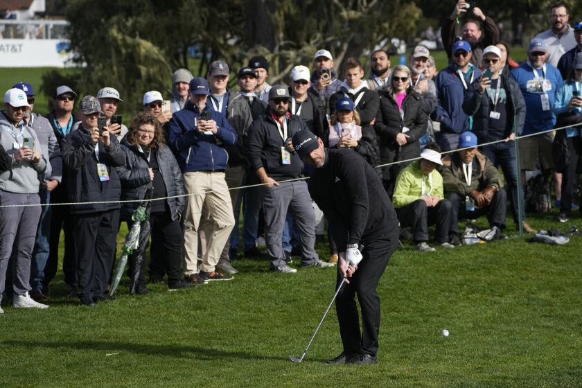 Aaron Rodgers follows his shot onto the 16th green of the Pebble Beach Golf Links during the third round of the AT&T Pebble Beach Pro-Am golf tournament in Pebble Beach, Calif., Sunday, Feb. 5, 2023. (AP Photo/Godofredo A. Vásquez)