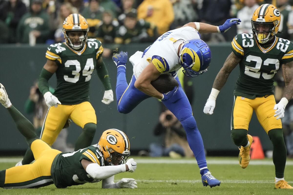 Rams receiver Cooper Kupp (10) runs  after catching a pass against the Green Bay Packers.