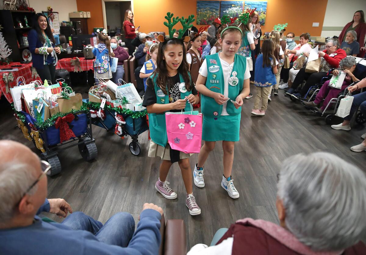 Girl Scouts of Orange County deliver holiday gift bags  to seniors.