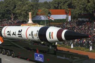 FILE - In this Jan. 26, 2013, file photo, the long range ballistic Agni-V missile is displayed during Republic Day parade, in New Delhi, India. India has successfully conducted its first test flight of a domestically developed missile that can carry multiple warheads, Prime Minister Narendra Modi said Monday. (AP Photo/Manish Swarup, File)