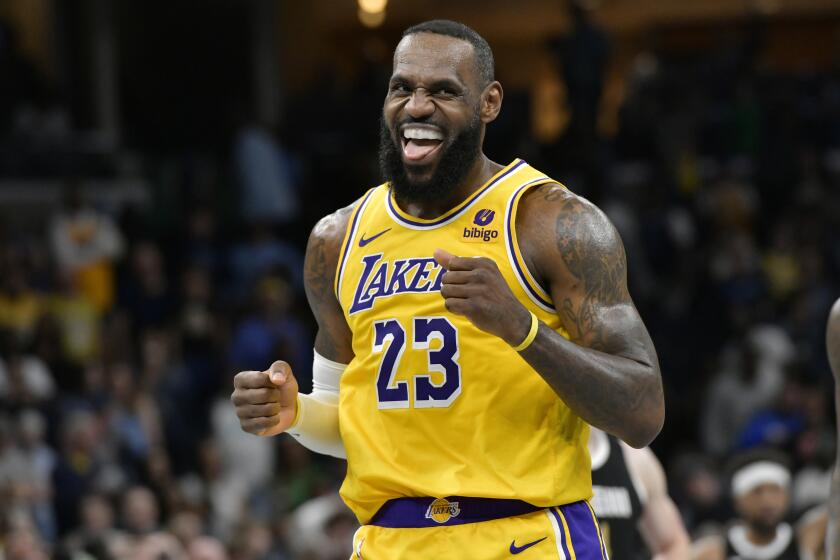 Los Angeles Lakers forward LeBron James (23) looks toward the Memphis Grizzlies' bench.