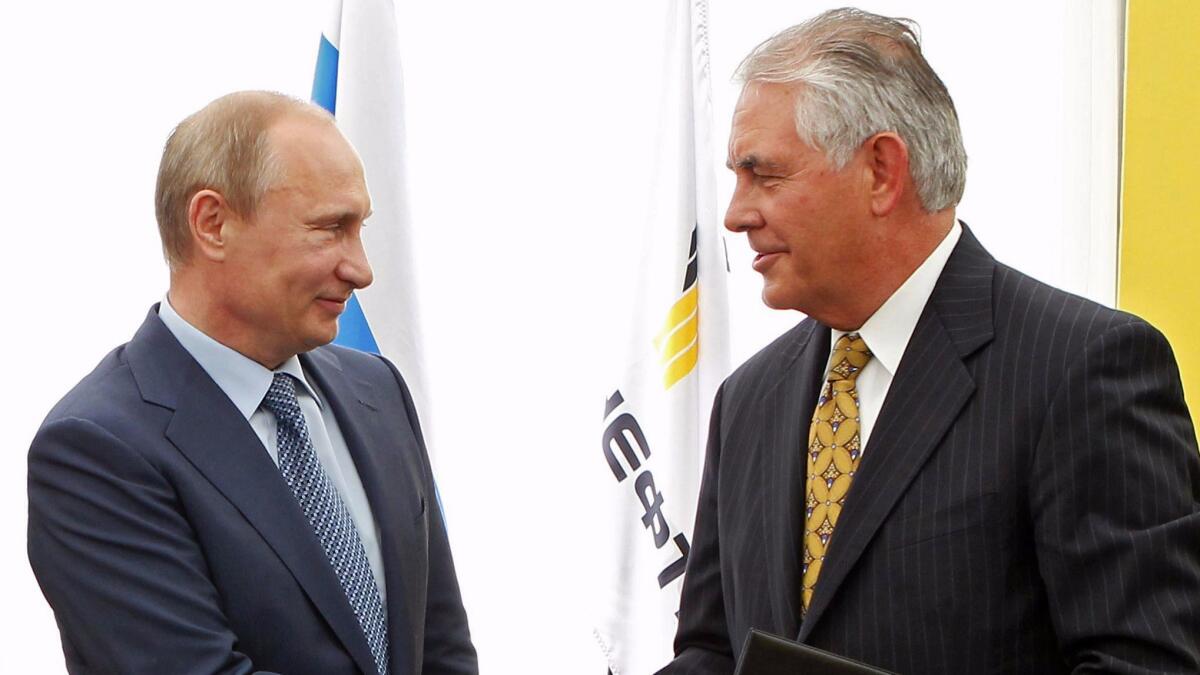Russian President Vladimir Putin, left, and Exxon Mobil CEO Rex Tillerson at a 2012 signing ceremony in Russia.