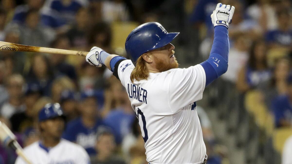 Dodgers third baseman Justin Turner hits a run-scoring double during the fourth inning of Tuesday's game against the San Diego Padres.