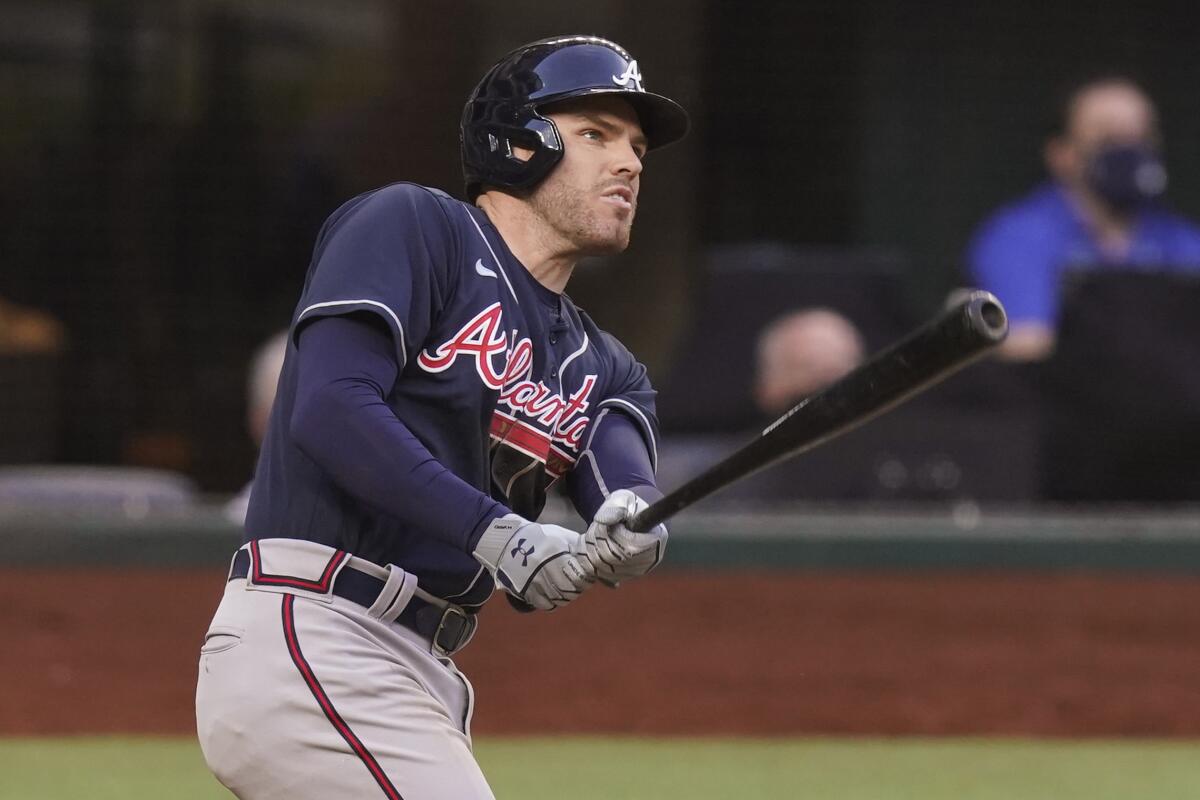 Atlanta Braves first baseman Freddie Freeman watches his two-run home run during the fourth inning in Game 2 of the NLCS.