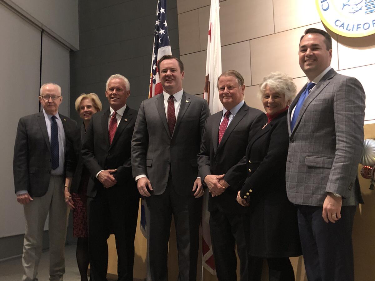 The Newport Beach City Council is now led by new Mayor Will O'Neill, center, and Mayor Pro Tem Brad Avery, third from left.