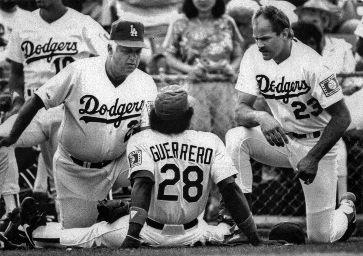 March 4, 1988: Dodgers manager Tommy Lasorda chats with Pedro Guerrero and Kirk Gibson before a spring training game against the Minnesota Twins.