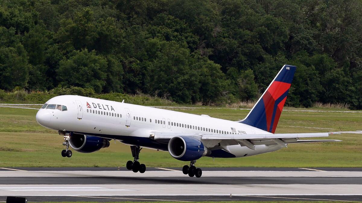Delta Air Lines said the LAX kitchen operated by Gate Gourmet complies with local and federal regulations. Above, a plane takes off in Florida.