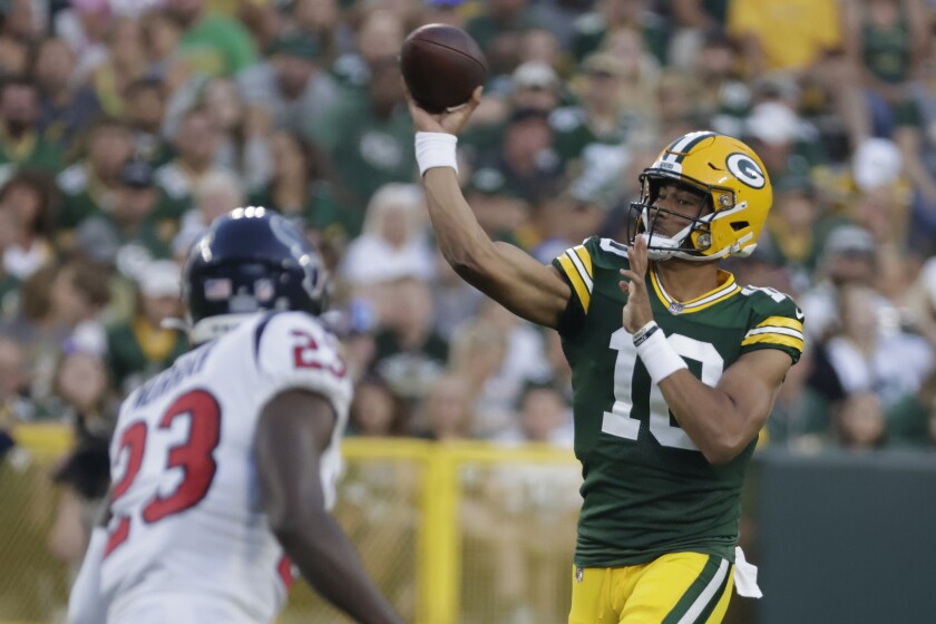 Green Bay Packers' Jordan Love throws during the first half of a preseason NFL football game against the Houston Texans Saturday, Aug. 14, 2021, in Green Bay, Wis. (AP Photo/Mike Roemer)