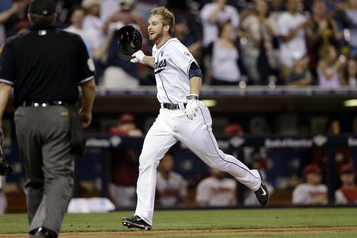 The Padres' Cory Spangenberg celebrates as he heads home after hitting a walk off home run against the Arizona Diamondbacks during the ninth inning of a baseball game Tuesday, Sept. 2, 2014, in San Diego. The Padres won 2-1.