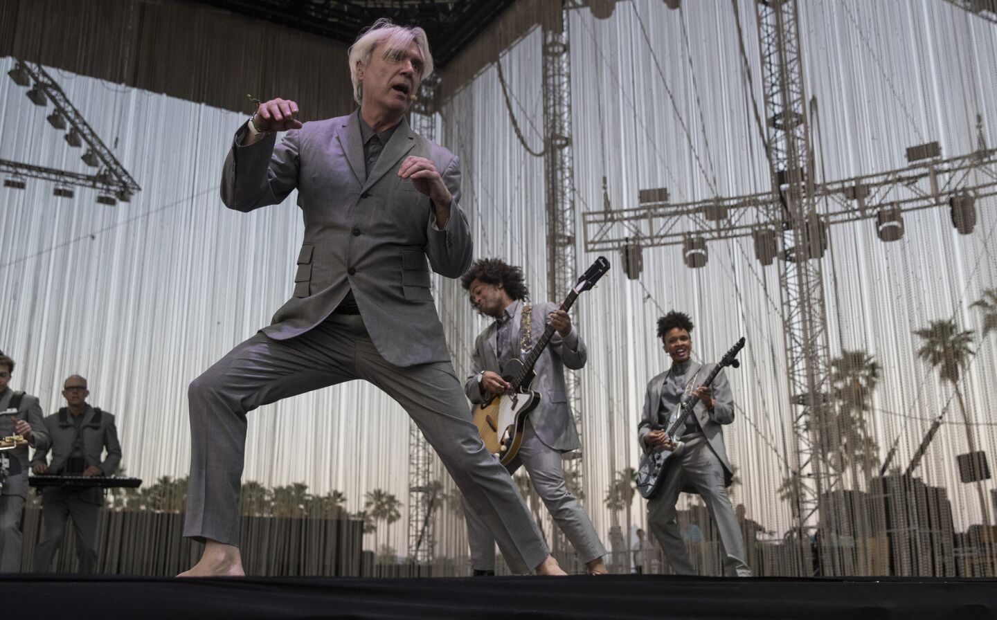 Back with a vengeance, a barefoot David Byrne performs.
