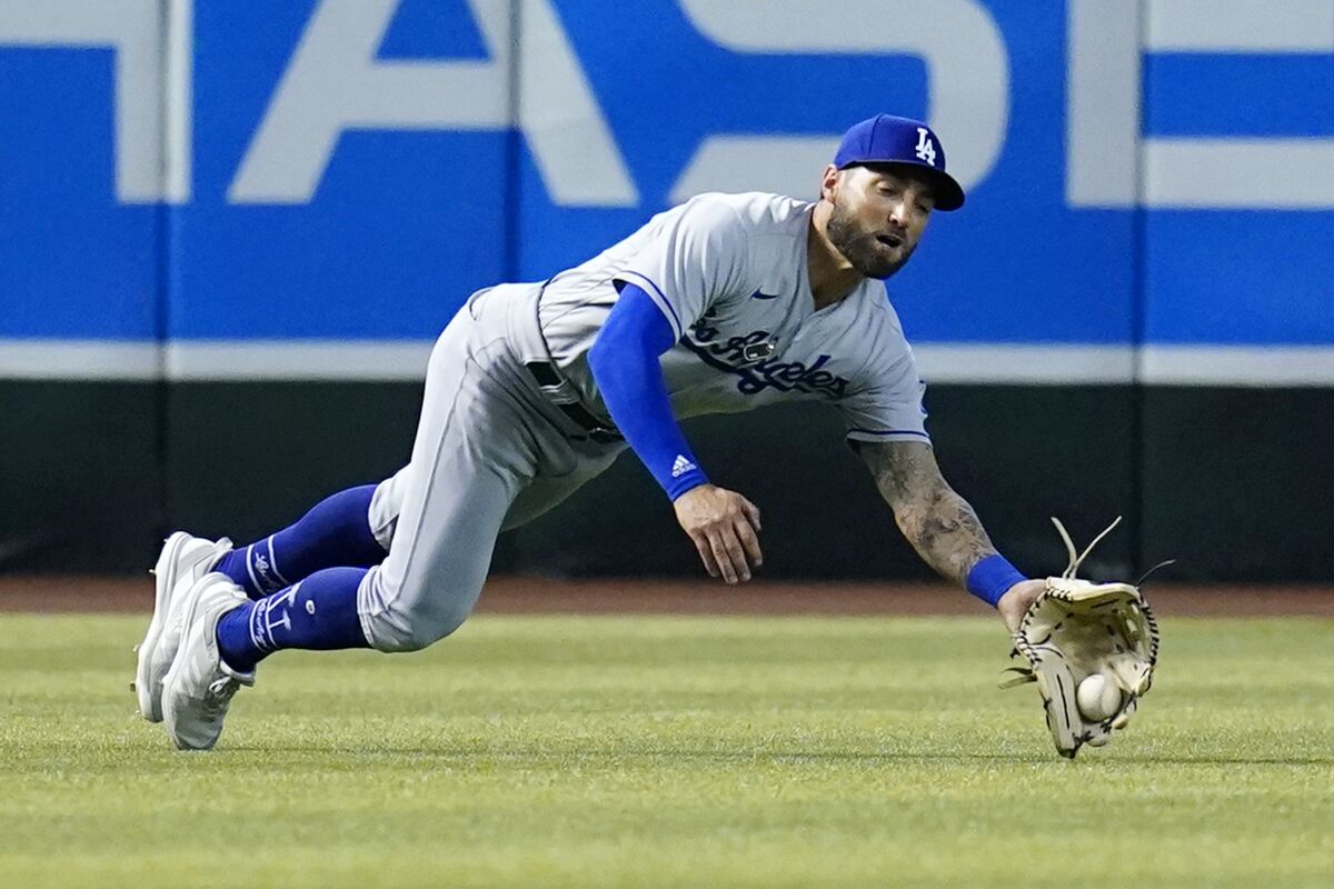 Dodgers left fielder Kevin Pillar makes a diving catch against the Arizona Diamondbacks on May 29.