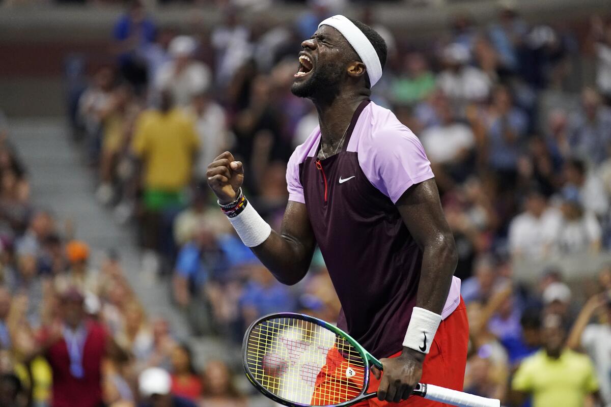 Frances Tiafoe celebrates after winning a point during his upset victory over Rafael Nadal.