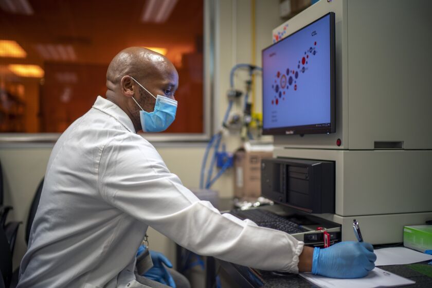 Sandile Cele studies the Omicron variant at the Africa Health Research Institute in Durban, South Africa.