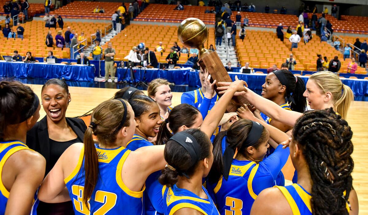 UCLA players celebrate after their 62-60 win over West Virginia in the WNIT championship basketball game on Saturday.