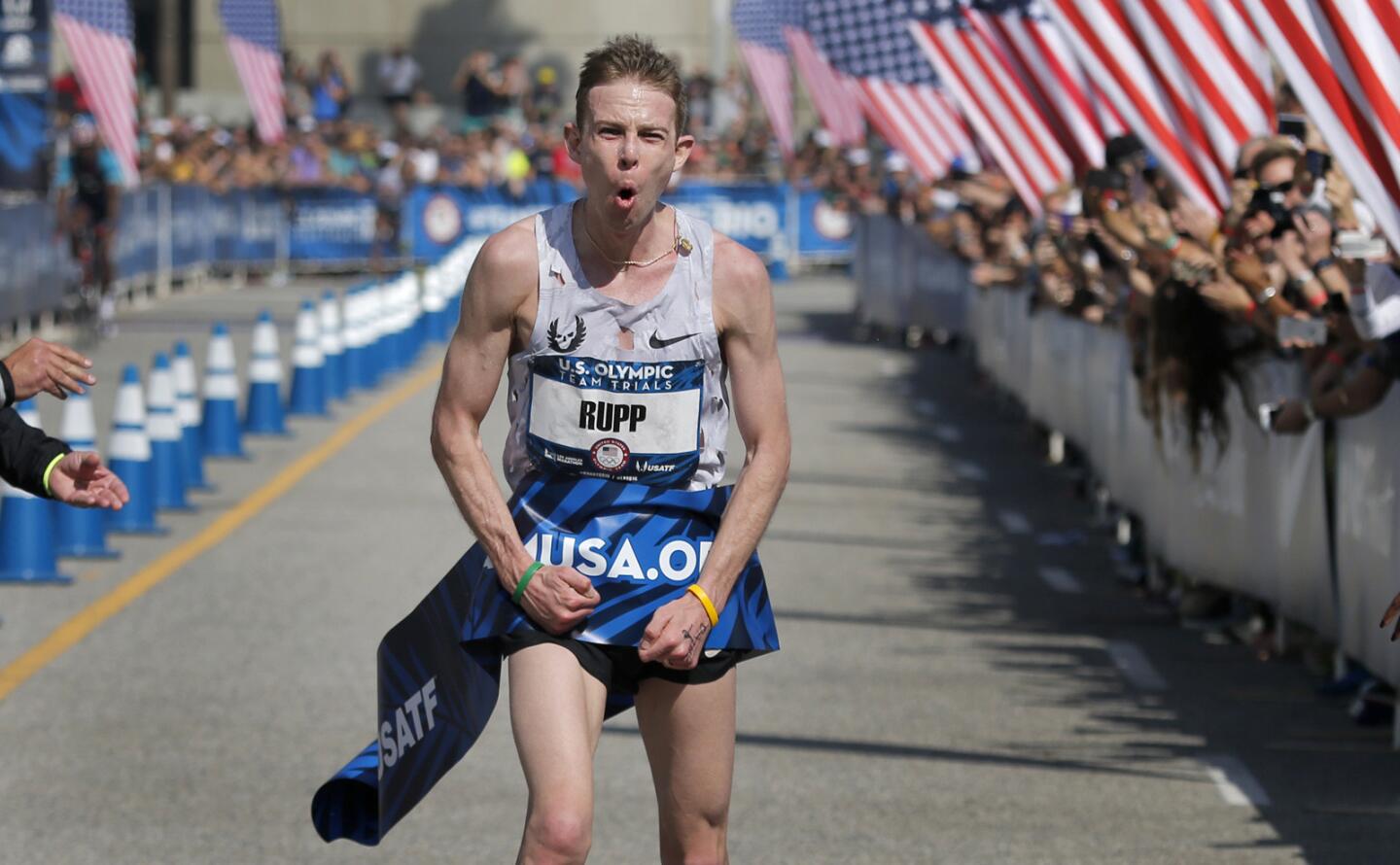 Galen Rupp of Portland, Ore., celebrates his victory after crossing the finish line in the U.S. Olympic men's marathon trial on Saturday in downtown Los Angeles.